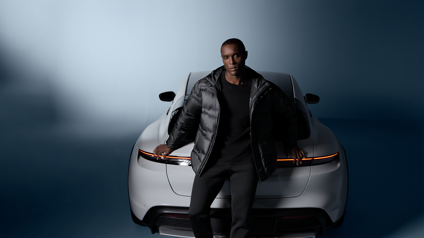 Shows Picture of pd-fashion-fw-2024-man-wearing-pd-fashion-in-front-of-porsche.png