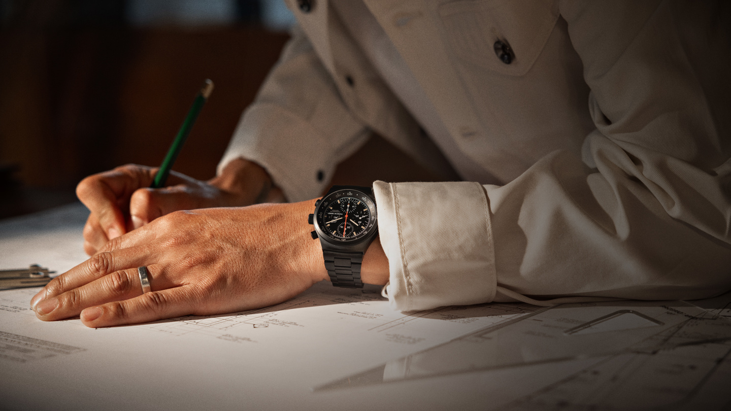 Shows Picture of man-writing-on-plan-watch-on-wrist.jpg